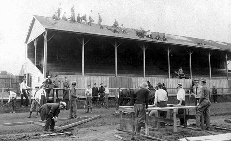 Men working at Hayward to install the new cinder track Men working at Hayward to install the new cinder track