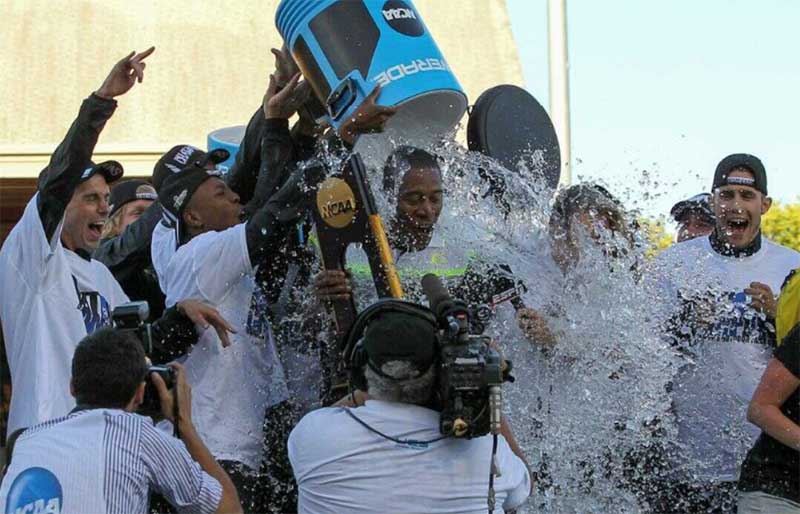 University of Oregon head track and field coach Robert Johnson being doused with water by the team after winning the 2015 team title at the NCAA track and field championships on June 12, 2015 at Hayward Field. University of Oregon head track and field coach Robert Johnson being doused with water by the team after winning the 2015 team title at the NCAA track and field championships on June 12, 2015 at Hayward Field.