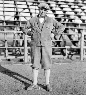 University of Oregon track coach Bill Hayward standing in front of the bleachers at Hayward Field in 1926.
