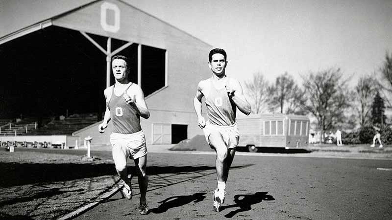 distance runners Bill Dellinger (left) and Jim Bailey running at Hayward Field during a 1955 practice