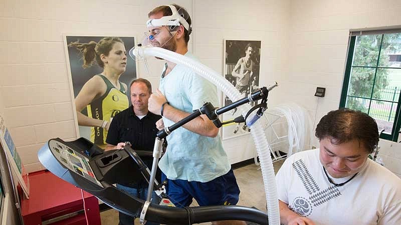 Bowerman Sports Science Clinic Director Michael Hahn working with an athlete in his lab in the Bowerman Family Building Bowerman Sports Science Clinic Director Michael Hahn working with an athlete in his lab in the Bowerman Family Building