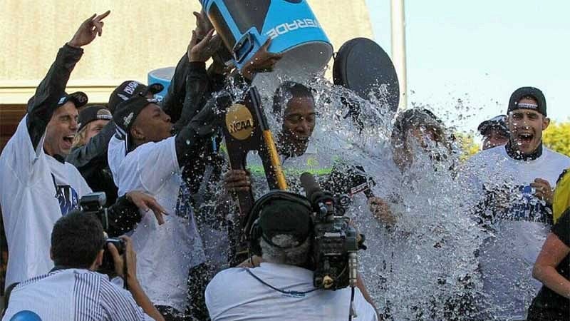 University of Oregon head track and field coach Robert Johnson being doused with water by the team after winning the 2015 team title at the NCAA track and field championships on June 12, 2015 at Hayward Field.