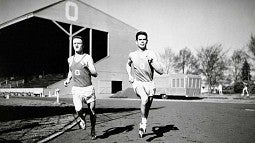 distance runners Bill Dellinger (left) and Jim Bailey running at Hayward Field during a 1955 practice distance runners Bill Dellinger (left) and Jim Bailey running at Hayward Field during a 1955 practice