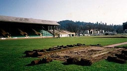 The northwest jumping pit surrounded by rolls of sod during a renovation at Hayward Field around 1970