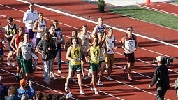 Ashton Eaton taking a victory lap with all of the decathletes at the NCAA Outdoor Track and Field Championships at Hayward Field